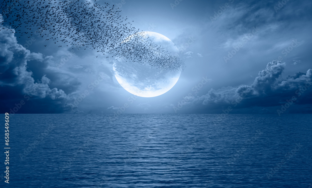Aufkleber Flock of starlings migrating to the moon - Silhouette of flock birds flying with full moon at sunset or sunrise 