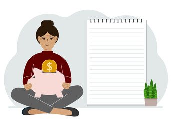 A woman sits cross-legged with a piggy bank in his hands. Nearby is a large sheet of paper for planning income and expenses.