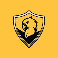 Eagle logo in a shield. Vector of an aggressive American eagle. symbol of power and protection. Bird protection logo. Silhouette of an eagle head. angry glare side pose. Nest for gamers and schools