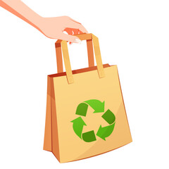 Hand holding eco friendly paper bag with recycling symbol.