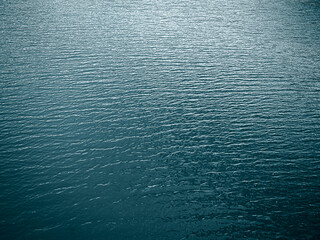 Sea Texture Water Blue Ocean Abstract Wave Pattern Background Surface Aqua Summer Ripple Deep Still Calm Sunlight Pattern Pool Wallpaper Material Design Nature Landscape for Tourism Travel Holidays.