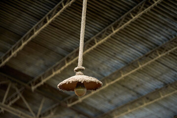 Chandelier covered with sawdust in a furniture processing factory