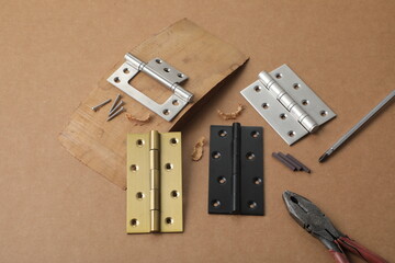 Installation of furniture hinges in chipboard. Small carpentry work in the workshop. light background,Installation of furniture hinges in chipboard in the workshop.dark background - obrazy, fototapety, plakaty