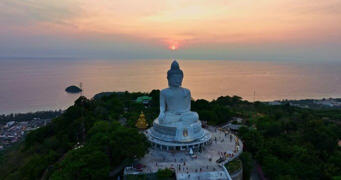 aerial view scenery yellow sky glare of sun above Phuket big Buddha.Phuket Big Buddha is one of the island most important and revered landmarks on the island..image for travel and culture concept..