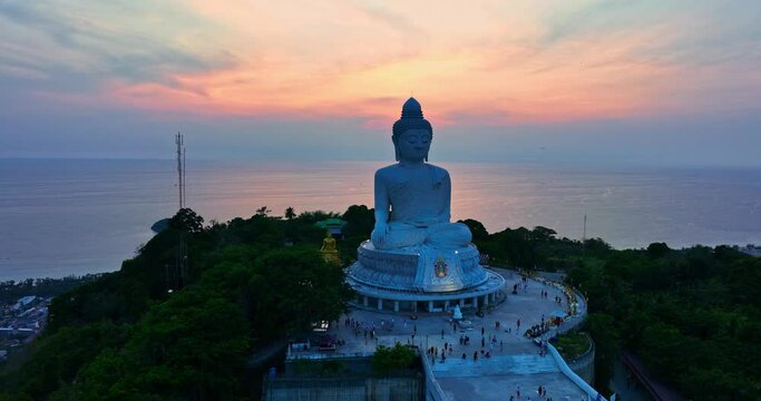 ..Amazing sweet sky in sunset at Phuket big Buddha. .The beauty of the statue fits perfectly with the charming nature..amazing pink sky in sweety sunset at Phuket big Buddha.
