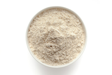 Bowl of organic Wheat flour (Triticum) isolated on a white background, top view.