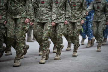 Soldiers in marching formation during military recruitment