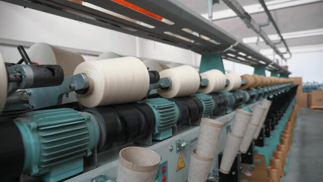 Threads production. Yarn making processes. Spinning production. Textile factory equipment. Textile factory.