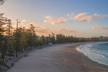 Sydney northern beaches main Manly beach facing pacific ocean on a sunny summer day with crowd of...