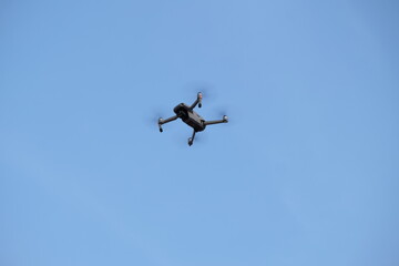 Remote-controlled drones fly to take photos and videos, capturing the atmosphere and activities from a high angle.