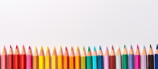 Vibrant pencils against isolated pastel background Copy space