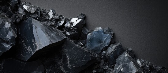 Unpolished black tourmaline isolated on a isolated pastel background Copy space