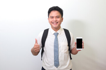 Indonesian senior high school student wearing white shirt uniform with gray tie showing and...
