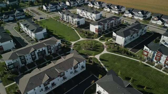 Drone wide shot footage. American new suburb at summertime. Establishing shot of neighborhood. wide drone footage