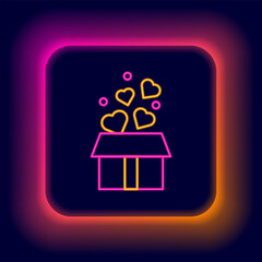 Glowing neon line Gift box with hearts icon isolated on black background. Valentines day. Colorful outline concept. Vector