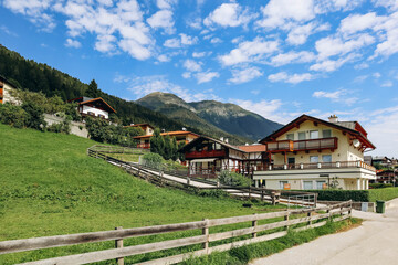 Fulpmes, Austria - August 15, 2023: Beautiful alpine landscapes and views of fields and farms in the village of Fulpmes, Austria
