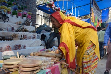 aged lady shopping at village fair in India 