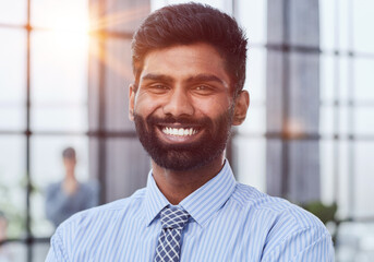 Close-up photo portrait of successful and happy businessman, male investor beard looking at camera