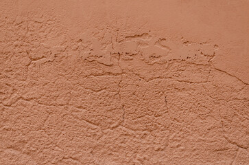 Grunge terracotta colored wall of an ancient Venetian building for your background. Italian architecture and heritage.