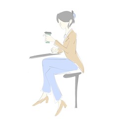 A woman drinking coffee at a cafe.