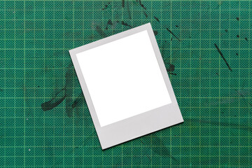 vintage Polaroid isolated on green background / instant photo frame / isolated graphic design...