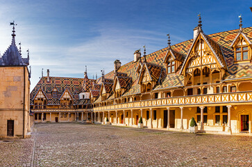 The Hospices de Beaune or Hôtel-Dieu de Beaune is a former charitable almshouse in Beaune, France - obrazy, fototapety, plakaty
