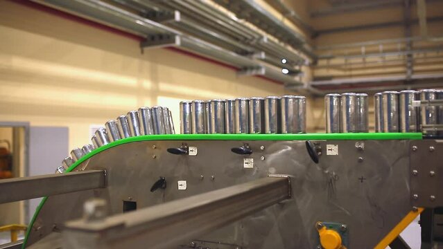 Conveyor line with the production of aluminum cans. Production of aluminum cans for drinks. Plant of high-tech equipment for the food industry.