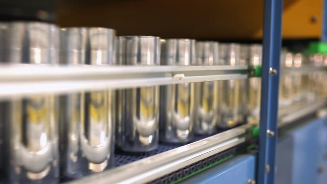 Conveyor line with the production of aluminum cans. Production of aluminum cans for drinks. Plant of high-tech equipment for the food industry.