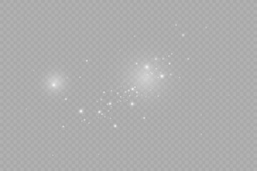 Dust sparks and stars shine with a special light. Christmas light effect. Glittering particles of magic dust.Vector sparkles on a transparent background.