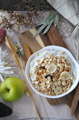 Top view of Yogurt with Granola Bowl on Board