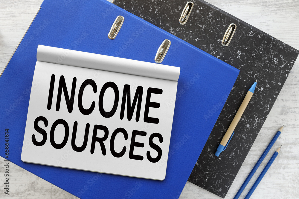 Aufkleber income sources open notepad with text on blue folder