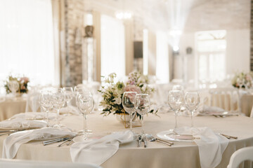 banquet hall in light colors, round tables