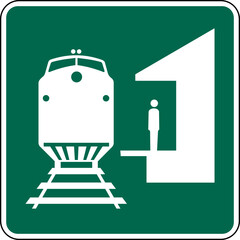 Naklejka premium Vector graphic of a green USA Train Station mutcd highway sign. It consists of a silhouette of a main line train and a person waiting on a platform contained in a green square