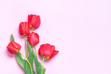 Bouquet of red tulips on pink background Top view Flat lay Holiday greeting card Happy moter's day, 8 March, Valentine's day, Easter concept Copy space Mock up