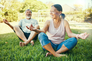 Senior couple, yoga and outdoor meditation on grass at park for mindfulness, peace or calm. Mature man, funny woman and yogi laughing for holistic exercise, wellness and zen to relax for body health