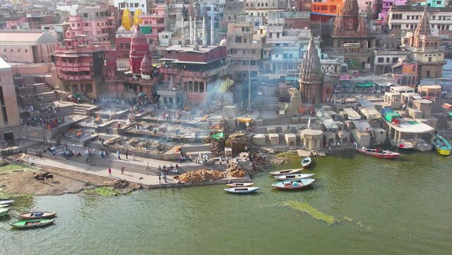 Fire Burial in Varanasi, India on Manikarnika ghat on Ganges River Drone 4K