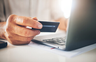 Hands, credit card and laptop in online shopping, e commerce or digital payment with work from home salary. Person typing, banking and information on computer for loan application or easy transaction