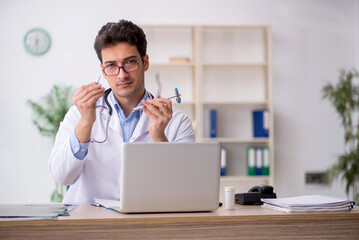 Young male doctor neurologist working in the clinic