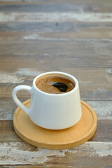 A cup of Turkish coffee on wooden table