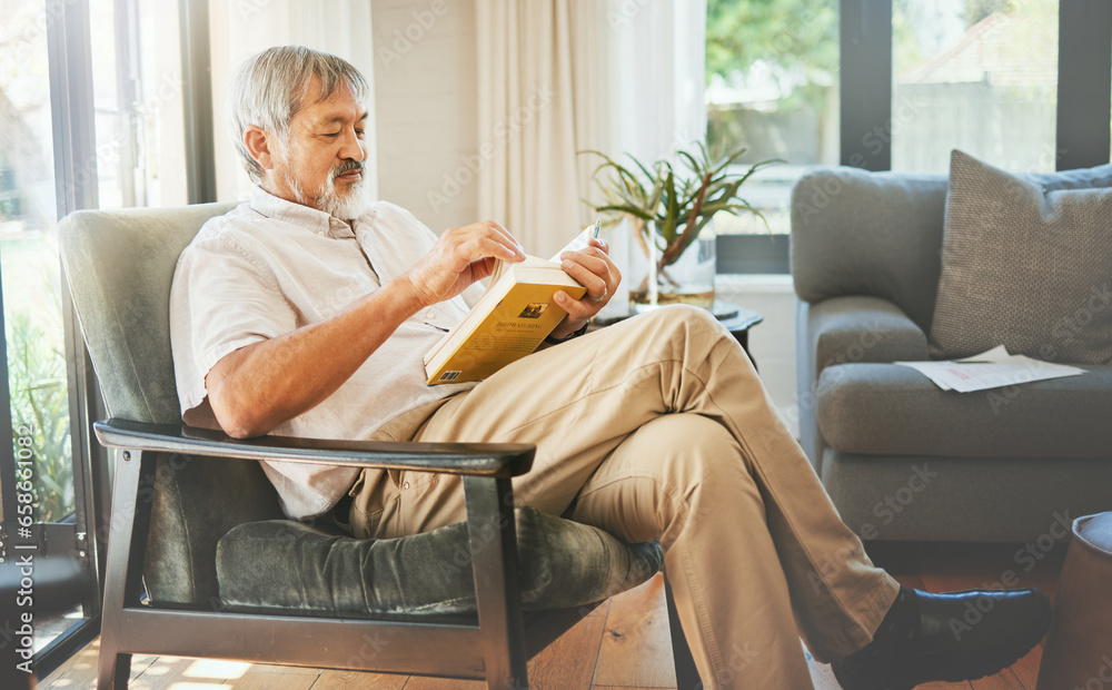 Sticker Relax, book and a senior asian man reading on a chair in the living room of his home during retirement. Study, learning and elderly person pensioner in his house alone for a literature leisure hobby