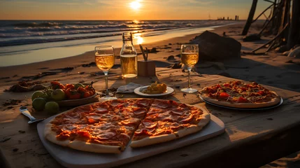 Fototapeten pizza on a table in the beach © JoypurerEdit