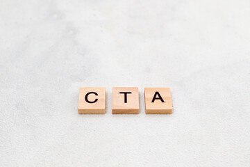Top view of CTA letter or (Call To Action) on wooden cube letter block on white background....