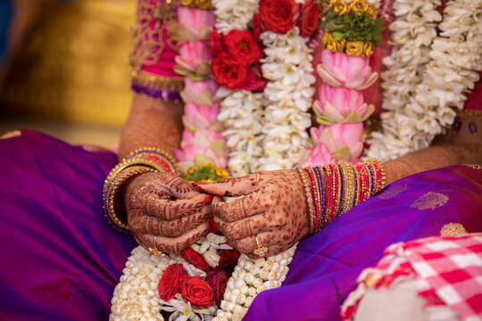 south indian wedding ceremony close up of mehndi hands of bride
