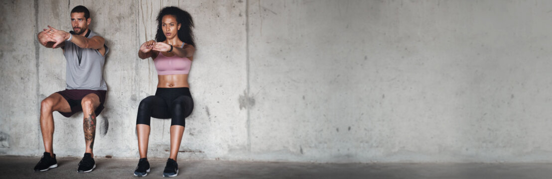 Couple, together and exercise for training on banner in mockup for health, wellness or gym. People, man and woman with wall sit for strength, endurance or power with vision, motivation and mindset