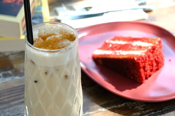 a slice of strawberry shortcake and a milkshake. 