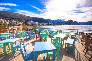 Town of Petrovac beach and  seafront cafe view