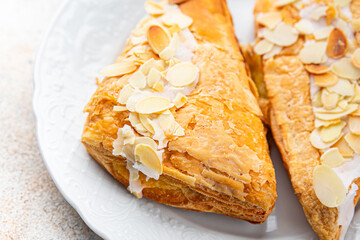 almond triangle cake cream puff pastry sweet dessert delicious healthy eating cooking appetizer meal food snack on the table copy space