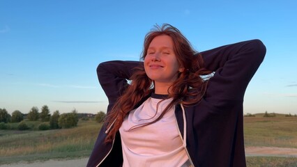 young beautiful woman relax and walking in the park at sunset or sunrise 