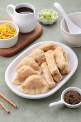 Pempek, mpek-mpek and also known as colloquially as empek-empek is a savoury Indonesian fishcake delicacy, made of fish and tapioca, from Palembang, South Sumatera, Indonesia. 