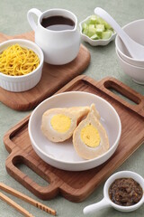 Pempek, mpek-mpek and also known as colloquially as empek-empek is a savoury Indonesian fishcake delicacy, made of fish and tapioca, from Palembang, South Sumatera, Indonesia. 